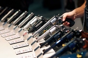 FILE - In this Jan. 19, 2016, file photo, handguns are displayed at the Smith & Wesson booth at the Shooting, Hunting and Outdoor Trade Show in Las Vegas. The gun industry is gathering for its annual conference, in January 2020, amid a host of uncertainty: slumping gun sales, a public increasingly agitating for restrictions on access to firearms and a presidential campaign that threatens gun rights like perhaps no other time in modern American history. (AP Photo/John Locher, File)