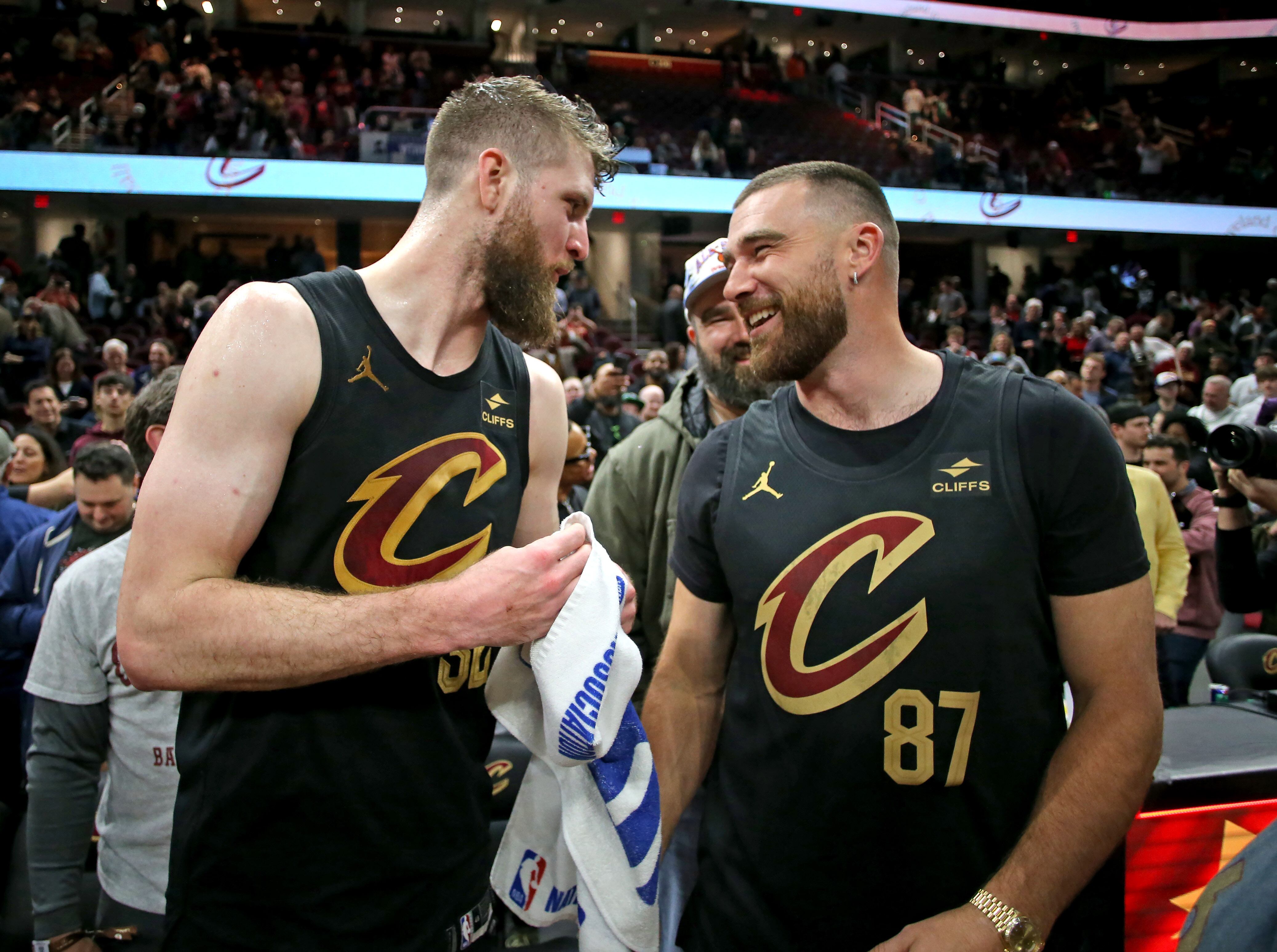 Cleveland Cavaliers forward Dean Wade greets Travis Kelce after the game against the Boston Celtics. 