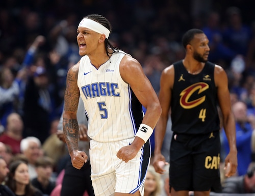 Orlando Magic forward Paolo Banchero reacts after sinking a three against the Cleveland Cavaliers in the first half of play.