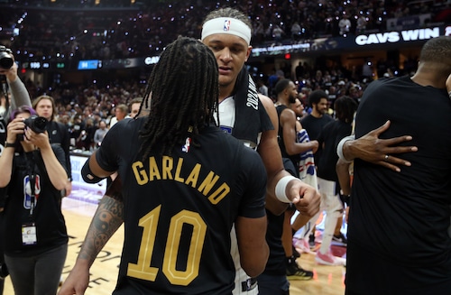 Cleveland Cavaliers guard Darius Garland and Orlando Magic forward Paolo Banchero hug after the Cavs defeated the Magic to advance to the Eastern Conference semifinals.